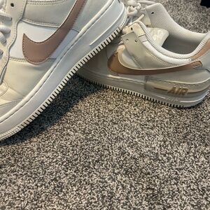 Nike White Sneakers with Beige Swoosh